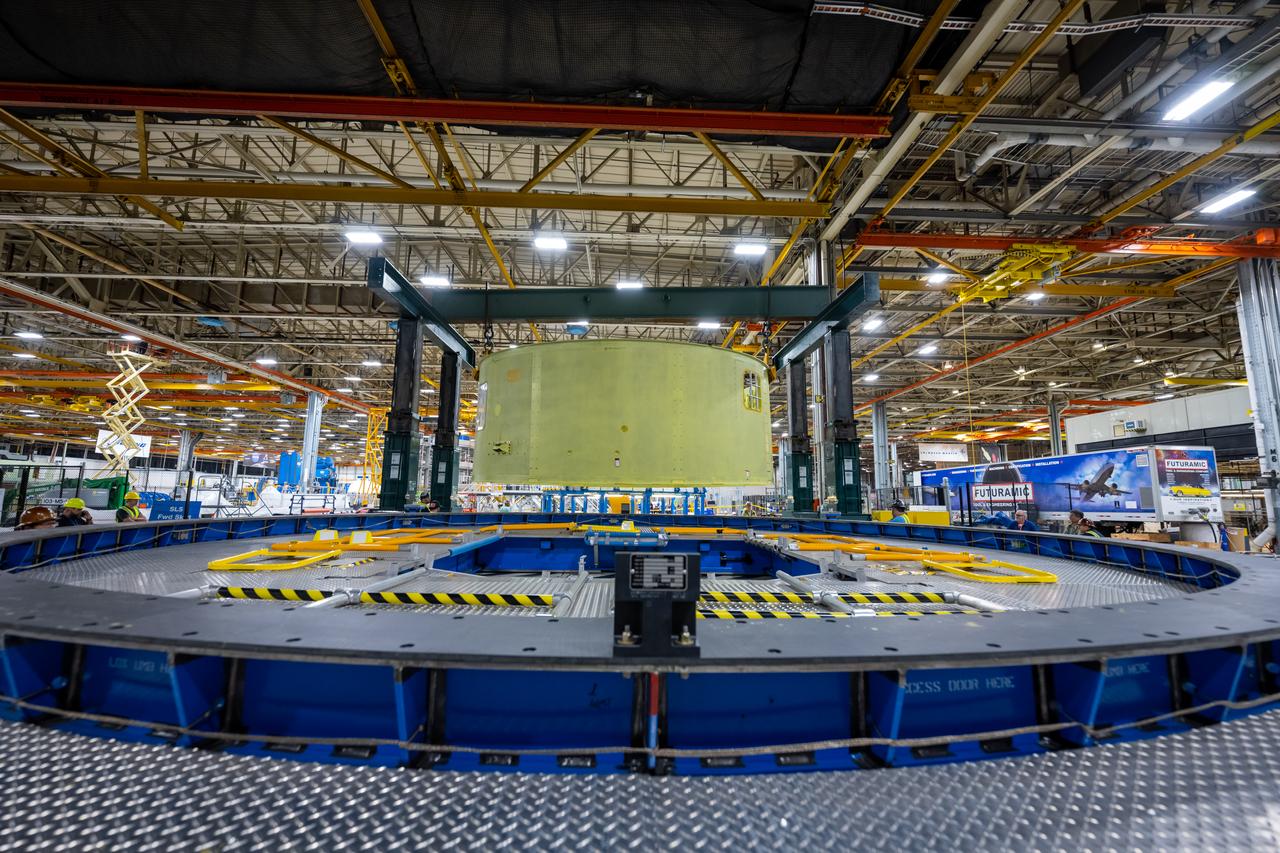 Crews at NASA’s Michoud Assembly Facility in New Orleans move the forward skirt of NASA’s Space Launch System (SLS) rocket to another part of the facility Dec. 15. Teams are preparing to apply the thermal protection system to the flight hardware, which will protect it from the extreme temperatures during launch and flight. The forward skirt is part of the core stage that will power the SLS rocket for the Artemis III mission. The forward skirt houses flight computers, cameras, and avionics.. The SLS core stage is made up of five unique elements: the forward skirt, liquid oxygen tank, intertank, liquid hydrogen tank, and the engine section. When fully stacked, the forward skirt is located at the top of the core stage and connects the stage to the upper part of the rocket. Together with its four RS-25 engines, the rocket’s massive 212-foot-tall core stage — the largest stage NASA has ever built — and its twin solid rocket boosters produce 8.8 million pounds of thrust to send NASA’s Orion spacecraft, astronauts and supplies beyond Earth’s orbit to the Moon and, ultimately, Mars. Offering more payload mass, volume capability and energy to speed missions through space, the SLS rocket, along with NASA’s Gateway in lunar orbit, the Human Landing System, and Orion spacecraft, is part of NASA’s backbone for deep space exploration and the Artemis lunar program. No other rocket is capable of carrying astronauts in Orion around the Moon in a single mission.